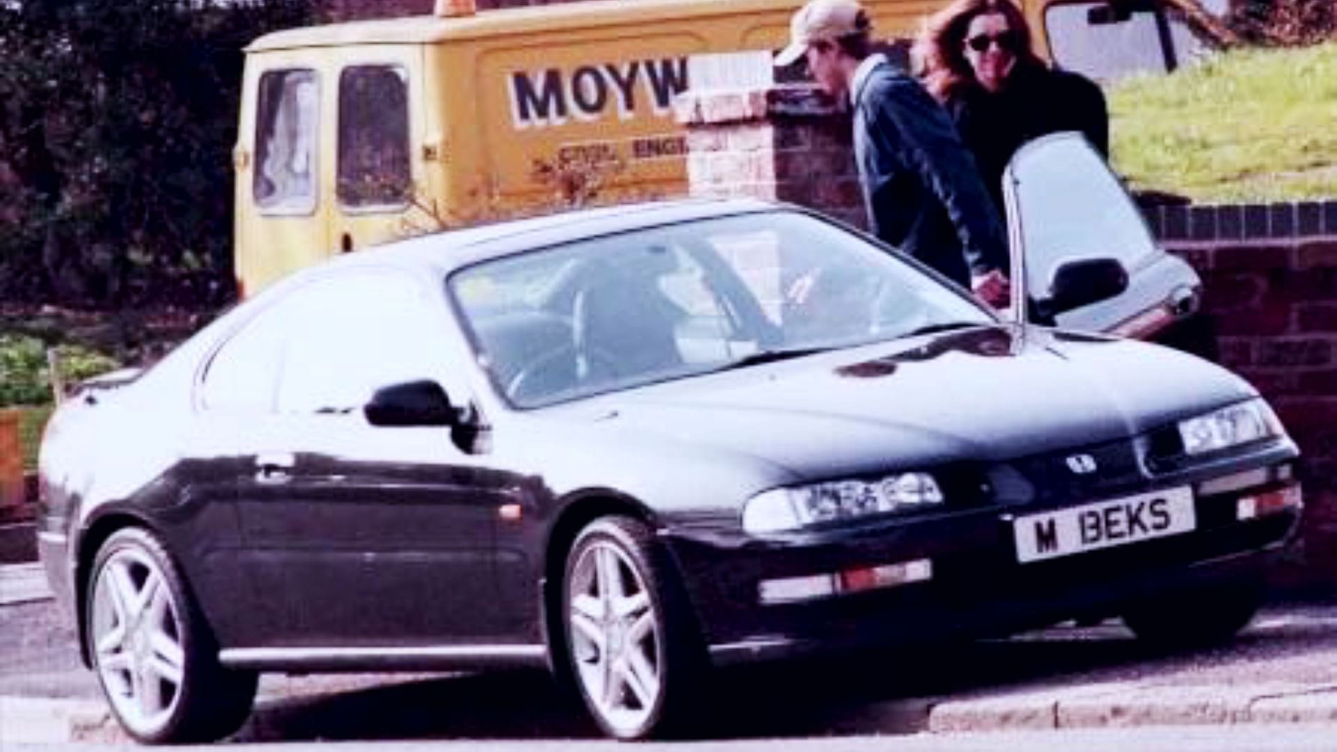 David Beckham and Victoria, with their Honda car