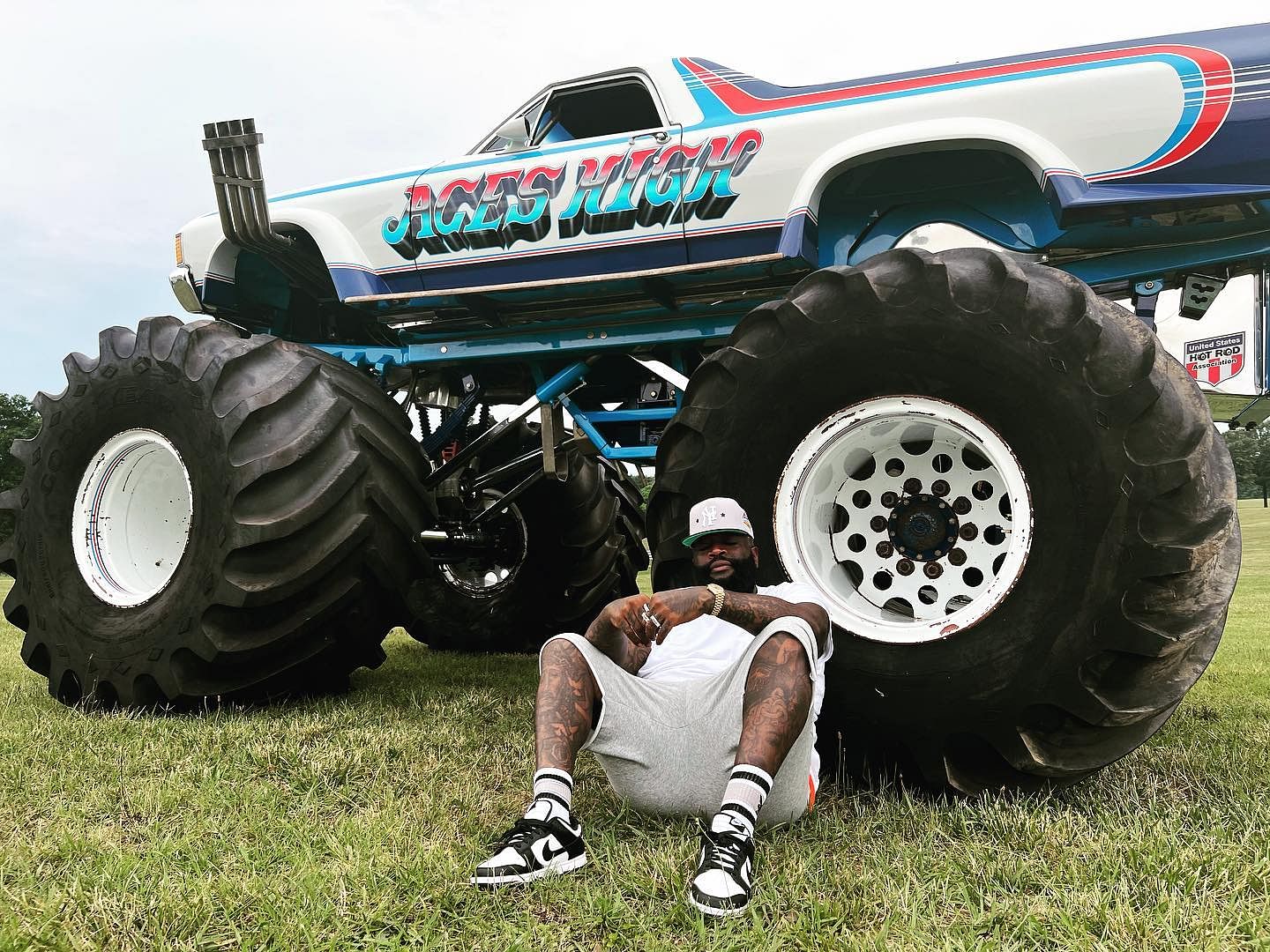 Rick Ross sitting infront of his El-Camino Monster Truck