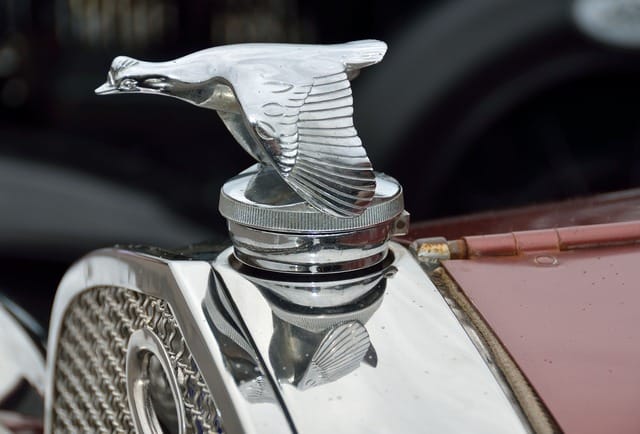 Close-up of sculpted Art Deco fender and chrome detailing on a 1930s French coupe