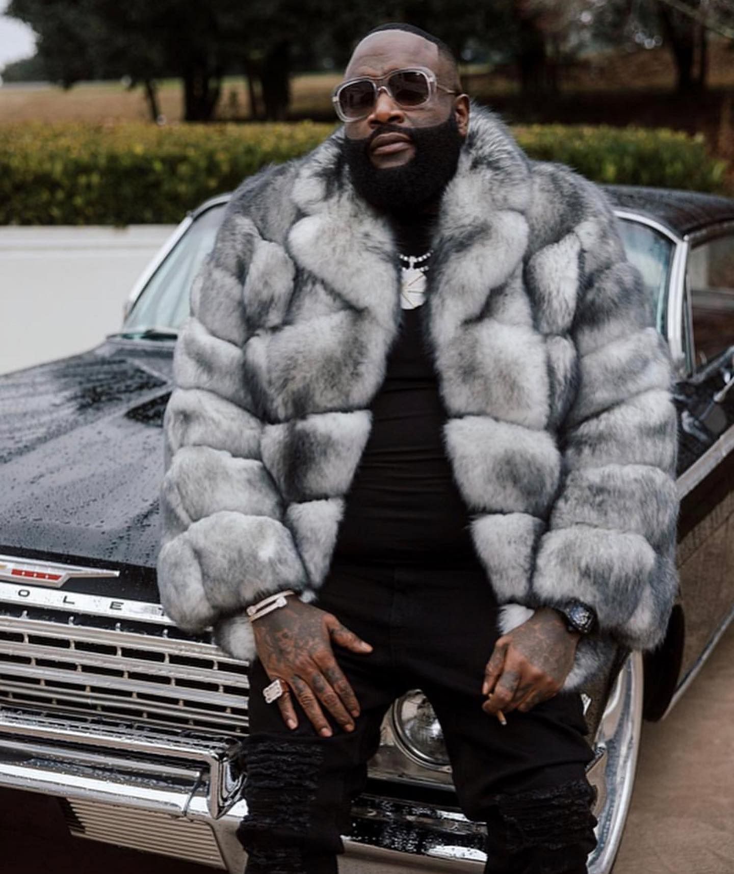 Rick Ross and his black 1962 Chevrolet Impala 