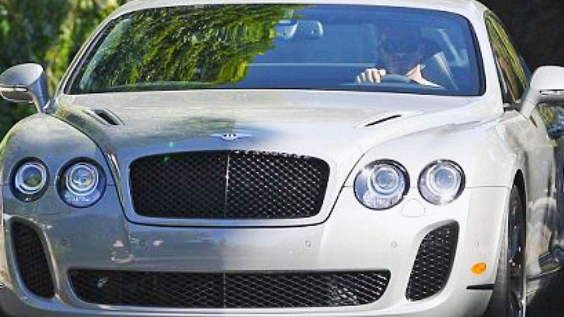 David Beckham driving around his Bentley Continental GT Supersports