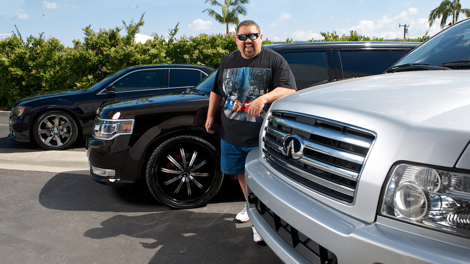 A collage of Gabriel Iglesias with a silver 2005 Infiniti QX56